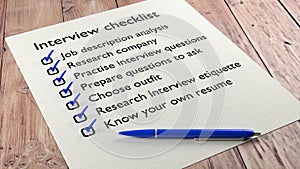 Interview checklist blue pen on wooden table