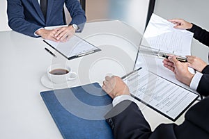 Interviewer or Board reading a resume during a job interview, Em