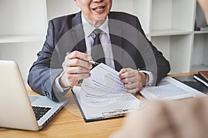 Interviewer or Board reading a resume during a job interview, Employer interviewing a young female job seeker for recruitment