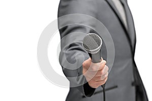 Interviewer or reporter with microphone in hand, mic