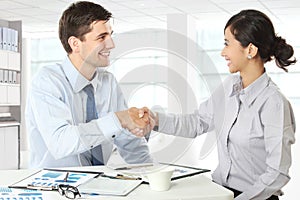 Interviewer shaking hand to future employee