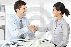 Interviewer shaking hand to future employee photo