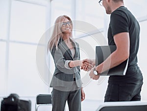 Interviewer welcomes the guest to the Studio