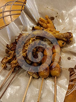 Intestinal satay, quail egg satay, and chicken chequer in angkringan