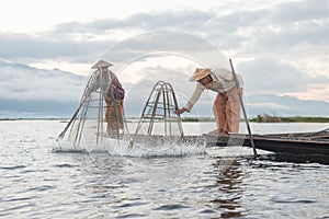 Intha fishermen working in the morning.Inle lake, Myanmar