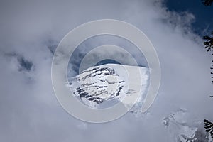 Keyhole view through Clouds of the Majestic Mt. Ranier