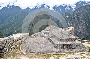 The Intiwatana or Inti Watana, a ceremonial stone at the Machu Picchu archaeological site. Cusco, Peru