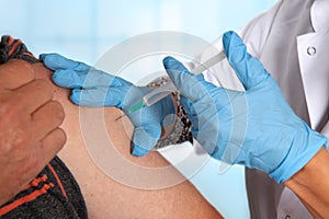 Intramuscular injection in upper arm