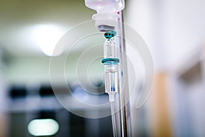 Intravenous therapy iv infusion set and bottle on a pole.