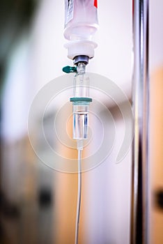 Intravenous therapy iv infusion set and bottle on a pole.