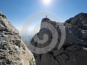 Intrepid and adventurous explorer`s hikes in wild mountains photo