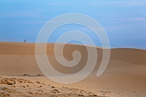 Intrepid Traveler on white sand dunes - Mui Ne photo