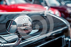 intresting view with reflect on a large mirror in a beautiful original old car. Retro photo