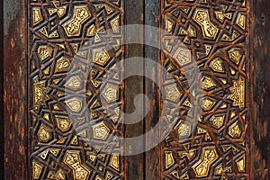 intricate arabesque intense rich wood relief close up decorated panel, texture background from a wall in Cairo