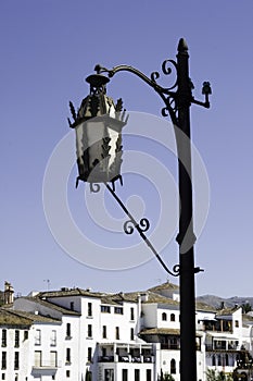 Intricate black street lamp in Spain