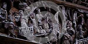 Intricate carving on the wooden exterior of a building in Huangling, Wuyuan, Jiangxi