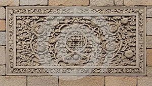 Intricate chinese stone carving with traditional patterns on brick wall