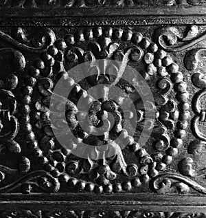 Intricate craftsmanship on antique wood door photo