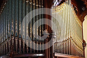 Intricate designs on organ pipes in a church