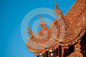INTRICATE DETAIL OF GABLE END CRAVED IN THAI-LANNA STYLE.