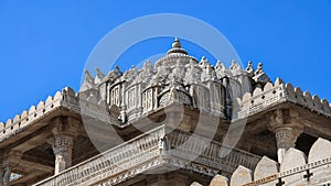 Intricate exterior architecture of historic Jain temple in Ranakpur, Rajasthan, India. Built in 1496