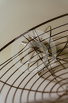 Abstract metallic structure with intricate wire and grid patterns, creating a modern and minimalistic design