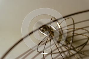 Abstract metallic structure with intricate wire and grid patterns, creating a modern and minimalistic design