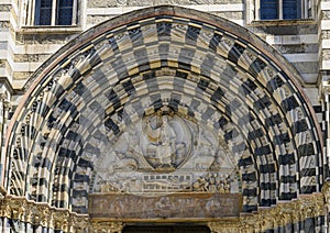 Intricate sculpture over the entrance to the Genoa Cathedral