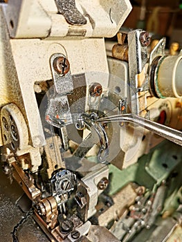 Intricate sewing machine mechanics, very close up view