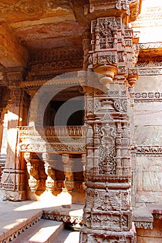 Intricate stone carving on a pillar, pilaster and entablature. Adalaj Stepwell, Ahmedabad, Gujarat