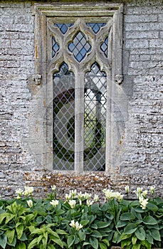 An intricate window in an old English country house