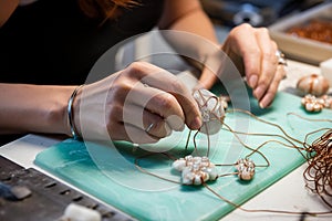 Intricate Wirework: Crafting a Delicate Pendant with Gemstones