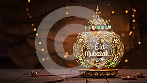 Intricately decorated lamp bearing Eid Mubarak wishes, festive vibes