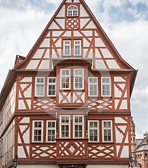 Intricately patterned facade of half-timbered medieval house in Mainz, Germany