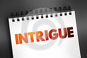 Intrigue text on notepad, concept background