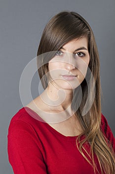 Introvert 20s woman with long hair expressing shyness photo