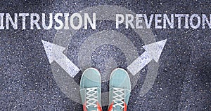 Intrusion and prevention as different choices in life - pictured as words Intrusion, prevention on a road to symbolize making