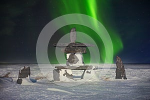 Inukshuk and Northern Lights in Canada. photo