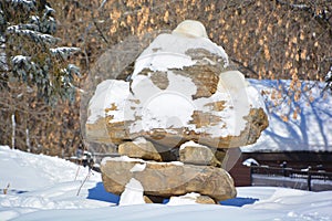 Inukshuk and trees in winter time Montrea