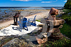 Inuksuk and Blue Chairs with a Beautiful View of the St-Lawrence Seaway photo