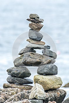 Inuksuk Standing in Front of the Atlantic Ocean