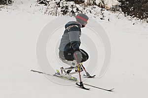 Invalid on a ski slope, competing