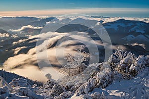 Inversion mist under Salatin peak in Low Tatras during winter sunset