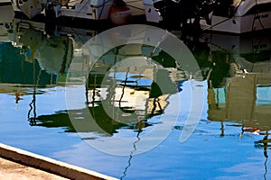 Inverted mirror image of yachts at sea