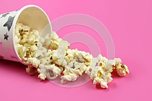 Inverted paper Cup with caramel popcorn background