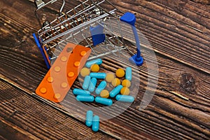 Inverted trolley and pills and medicines lie nearby, the concept of the uselessness and futility of treatment