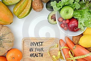 Invest in your health , Healthy lifestyle concept with diet and fitness , Get fit in  , fitness equipment and healthy food