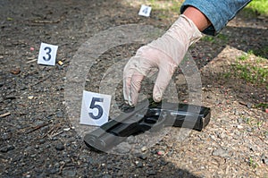 Investigator collects evidence - crime scene investigation