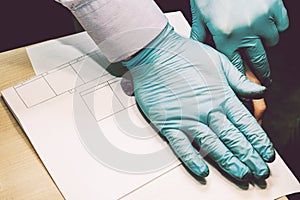 The investigator takes fingerprints from the suspect in the crime. Investigation is a crime. Crime.