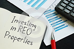 Investing in REO Properties is shown on the conceptual business photo photo